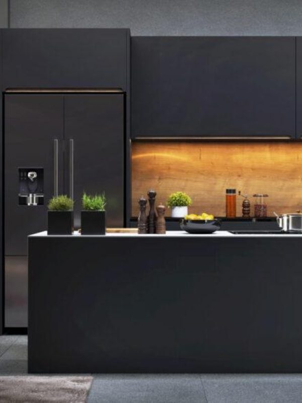 Beautiful open plan matte black kitchen and dining area with fir